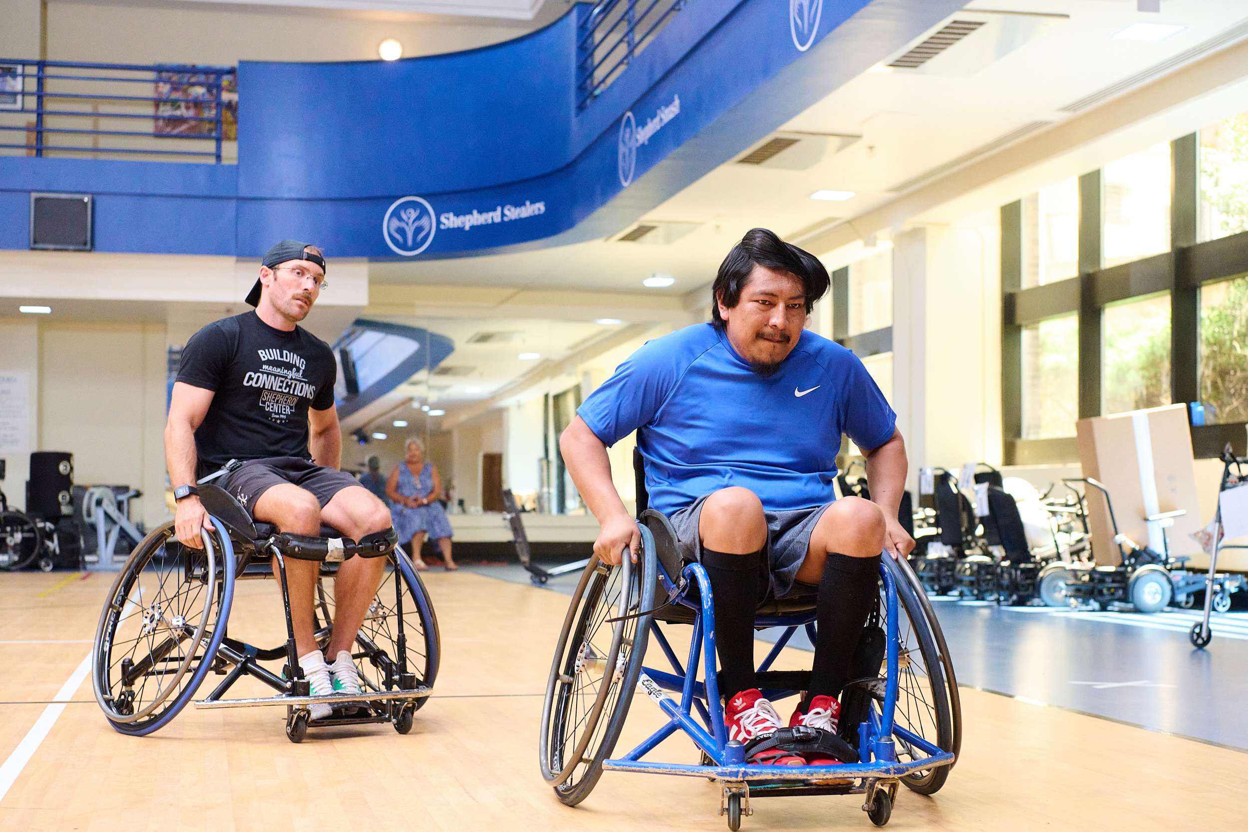 Two wheelchair users taking part in spinal cord injury rehabilitation at Shepherd Center